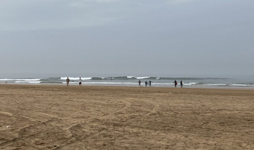 Surfing at L'Oued rivermouth in Sidi Kaouki, Morocco